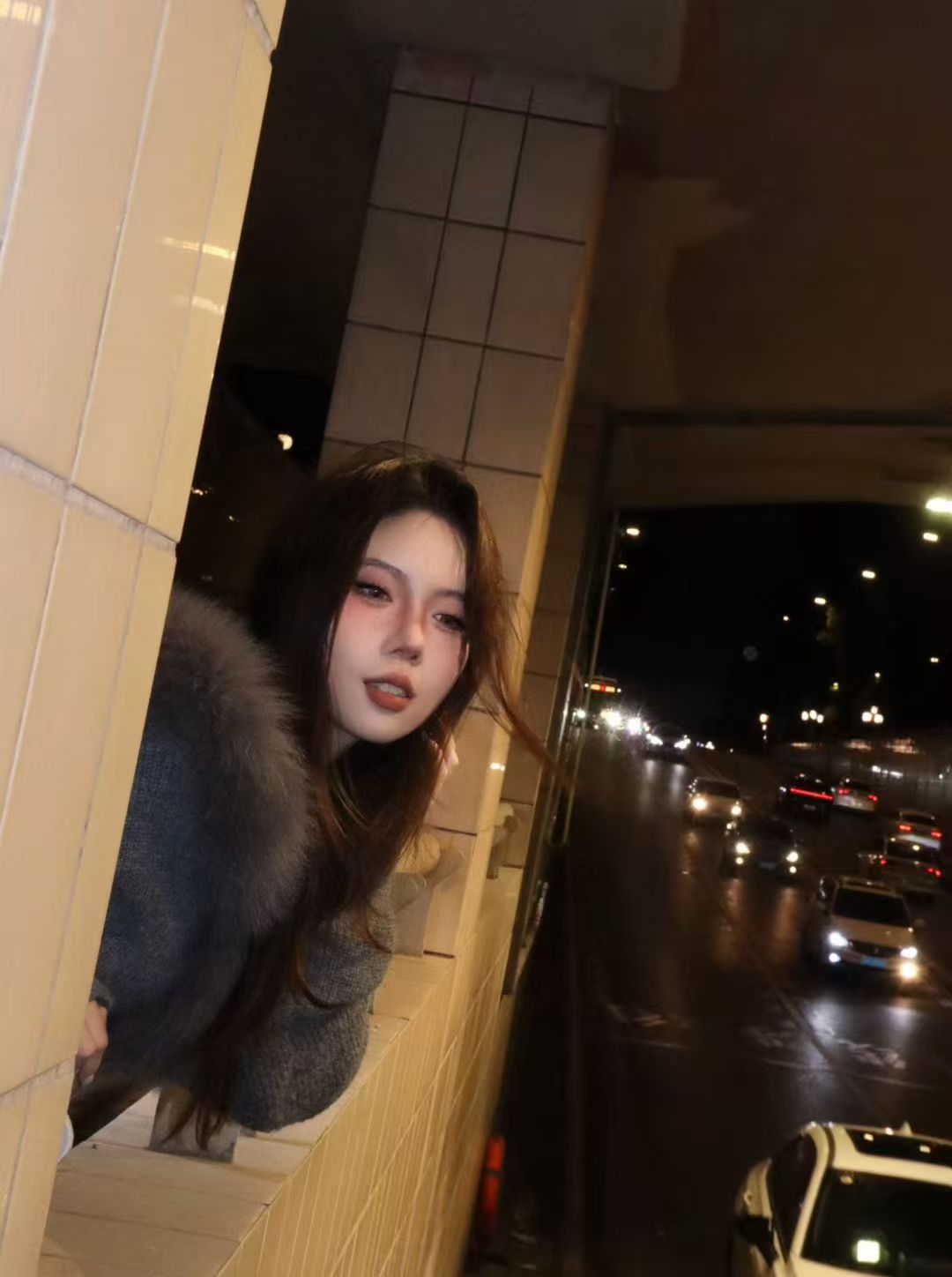 Hongni Chen at night in the city
